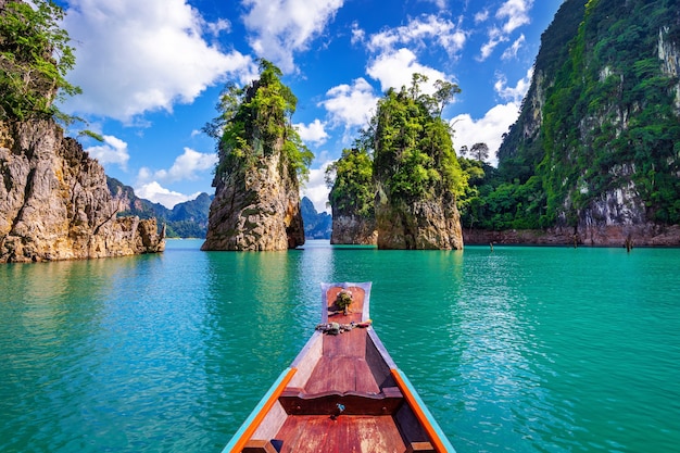 https://img.freepik.com/free-photo/beautiful-mountains-ratchaprapha-dam-khao-sok-national-park-surat-thani-province-thailand_335224-851.jpg